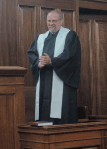 Black robe and white stole